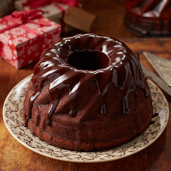 Dark colored Black Russian cake with glossy chocolate glaze.