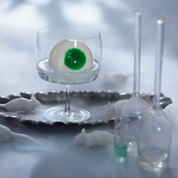 Vodka eyeball highball cocktail with a green 