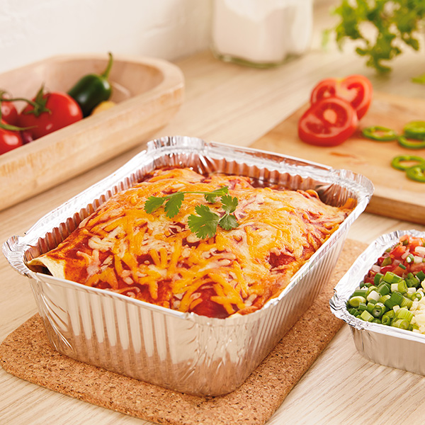 Easy enchiladas with red enchilada sauce, melted cheese and cilantro garnish on top.