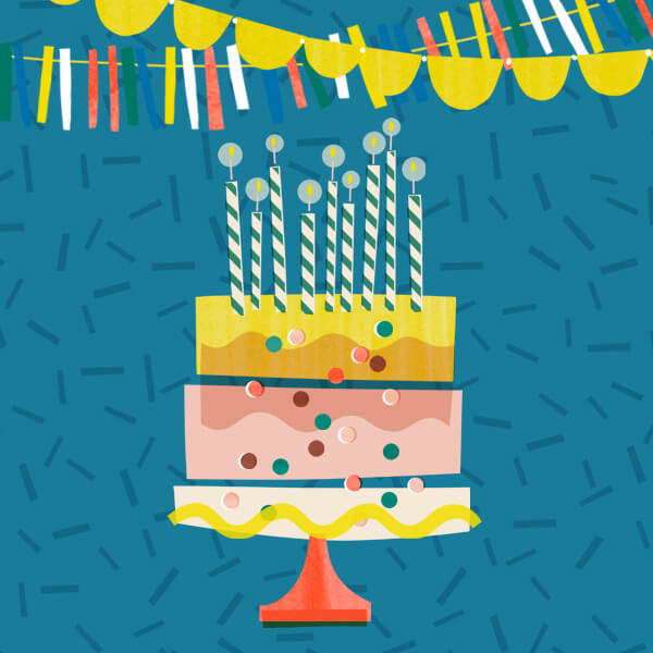 Birthday cake with candles and some banners to celebrate milestone birthday