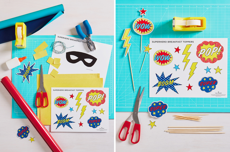 Superhero Father's Day breakfast decorations on craft table with supplies.