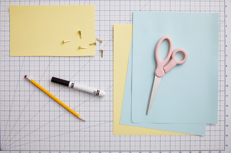 Pencil, marker, paper and scissors