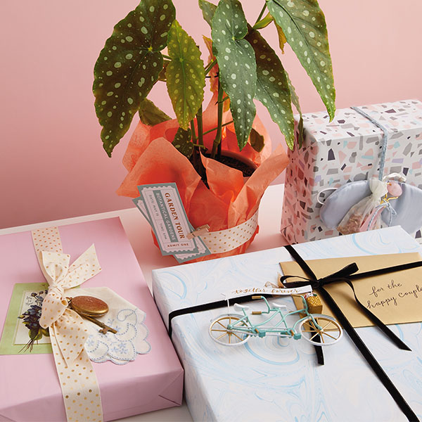 Personalized gifts on table with plant