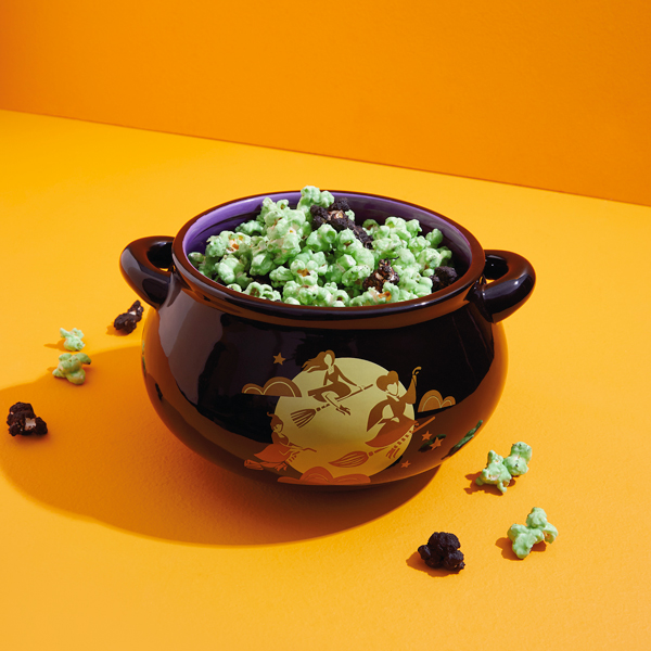 Black and green popcorn in a black Hocus Pocus cauldron snack bowl.