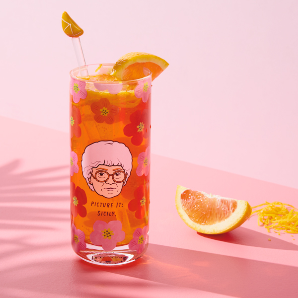 A drinking glass featuring an illustrated portrait of Sophia from the TV show