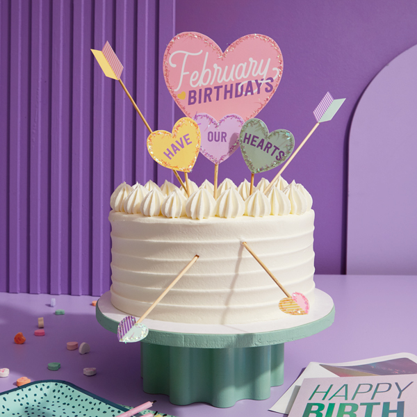A birthday cake with a topper that says,